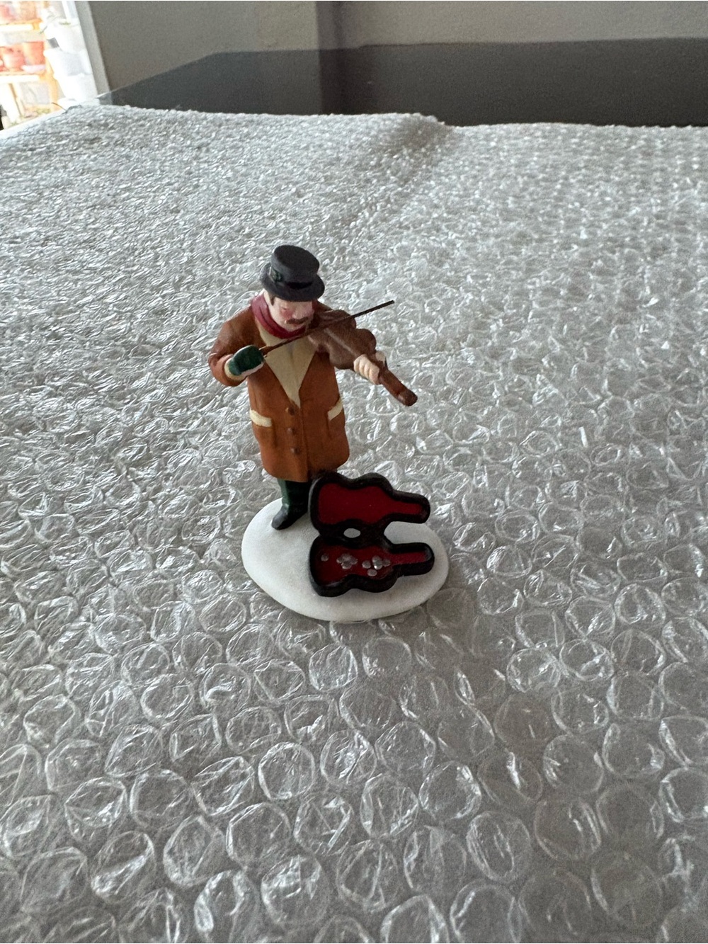 Department 56 "Christmas in the City" collection - man playing violin